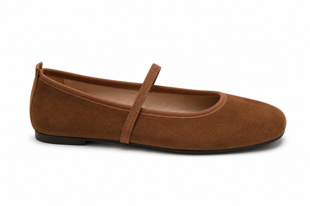 A single brown suede ballet flat shoe with a Mary Jane strap, shown in a side profile on a white background.