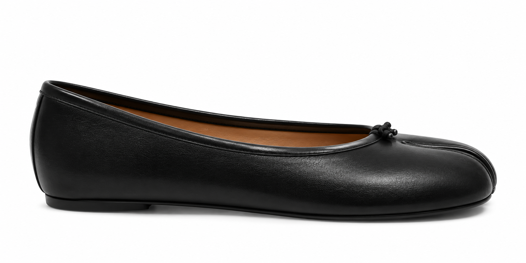 A single black leather ballet flat shoe with a small decorative bow on the toe, shown in a side profile against a white background.